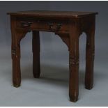 A Victorian Gothic Revival oak side table, the rectangular top above single frieze drawer, on