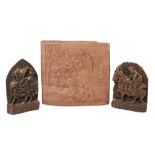 A matched pair of Indian carved wood plaques, each depicting narrative processions, one relief