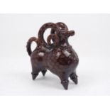 A Canakkale brown glazed pottery aquamaline, 19th/early 20th century, modelled as a ram, 21.5cm