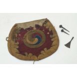 A Tibetan document case, 18th century, the woven fabric body designed with central spiral motif