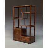 A Chinese hardwood display unit, late 20th Century, of rectangular form, with an arrangement of