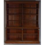 A pair of Victorian mahogany open bookcases, the moulded cornice above an arrangement of eight