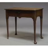 A George II mahogany side table, the rectangular top above single frieze drawer, raised on