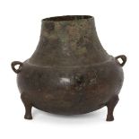 A Chinese bronze tripod vessel, Yuan dynasty, of bellied form with two lug handles to shoulder, 14cm