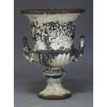 A Victorian cast iron and white painted Campana garden urn, with flared rim and handles emitting
