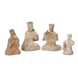 Four Chinese grey pottery musicians, Han dynasty, modelled kneeling wearing flowing robes, with