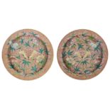 A pair of Chinese porcelain chargers, early 19th century, painted in famille rose enamels with