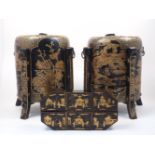 A pair Japanese black lacquer three tiered stacking boxes with domed covers, with gilt decorative