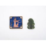 A Maori nephrite Tiki, 2cm high, together with an enamelled plaque of lapis blue ground, each side