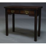 A George III mahogany tea table, the rectangular fold over top, above two frieze drawers raised on