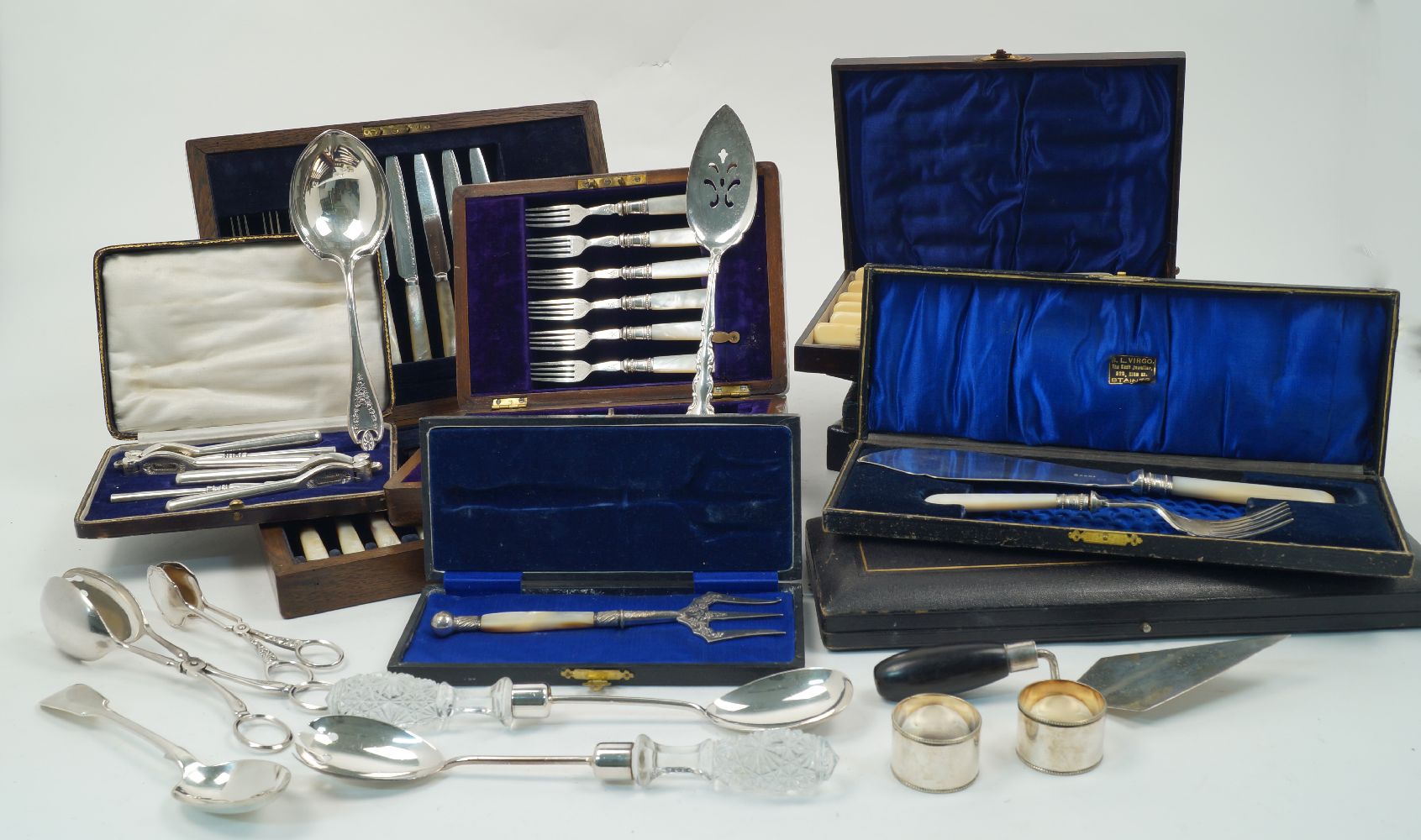 Several sets of silver plated flatware including: a set of twelve each dessert knives and forks with