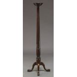 A George II style mahogany pedestal, late 20th Century, the circular top, on tapered and stop fluted
