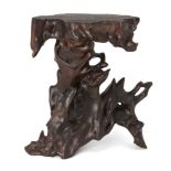 A large Chinese hardwood stand, late 19th/early 20th century, naturalistically carved, 38cm highA