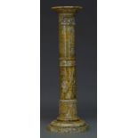 A variegated yellow and grey marble column, first half 20th Century, the circular top on tapered