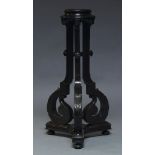 A late Victorian ebonised jardinière stand, the circular top on square acanthus carved scrolling