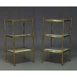 A pair of brass three tier etageres, second half 20th Century, with acorn finials and three