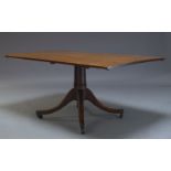 A mahogany breakfast table, 19th Century and later, the rectangular associated top, on tapering