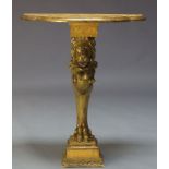 A carved giltwood console table, late 20th Century, with shaped faux marble top, above carved lion