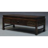 A Chinese hardwood low table, 20th Century, the rectangular top, above folate carved frieze, with