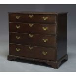 A George III oak and crossbanded chest of drawers, with four long graduated drawers, raised on