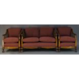A walnut and caned three piece suite, early 20th Century, to include a two seat sofa, 77cm high,