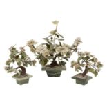 A garniture of three Chinese hardstone gem trees, early 20th century, each with rectangular base,