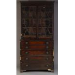 A George IV mahogany secretaire bookcase, the dentil moulded cornice, above astragal glazed doors