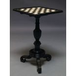 An Anglo Indian ebony and ivory inlaid chess table, the square top on turned and reeded support,