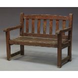 A child's garden bench, second half 20th Century, of diminutive proportions, with slatted back and