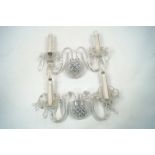 A selection of bohemian style crystal wall sconces, 20th century, each with twin branches, bowls