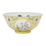 A Chinese porcelain bowl, Republic period, painted in famille rose enamels with medallions