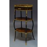 A French walnut, ebonised and gilt metal mounted three tier etagere, late 19th Century, the shaped