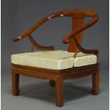 A Chinese hardwood horse shoe armchair, late 20th Century, with curved back and loose seat