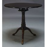 A George III and later mahogany tilt top occasional table, the circular top above birdcage action on