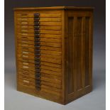 A beech plan chest, late 19th, early 20th Century, comprising twenty drawers, 124cm high, 93.5cm