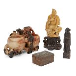 A Chinese soapstone carving of Shou Lao, early 20th century, carved seated and tugging his beard,