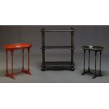 A Victorian ebonised and parcel gilt three tier etagere, the rounded rectangular tiers on turned and