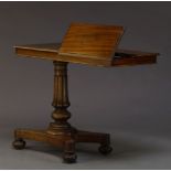 A Regency mahogany reading table, the rectangular top with two reading stands on ratchet mechanisms,