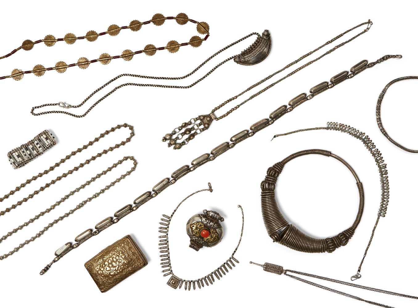 A large collection of Tibetan, Indian and African white metal jewellery, to include: A Kutch neck