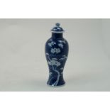 A Chinese prunus pattern vase, late 19th/early 20th century, of baluster form, removable cover