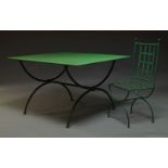 A French green painted metal garden table, c.1960, the rectangular top on x-shaped supports, 72cm