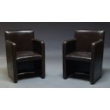 A pair of modern brown leather armchairs, of recent manufacture, with square backs and square
