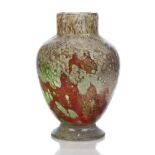 A Monart glass vase, with internal bubbles and aventurine inclusions, on an applied glass foot, with