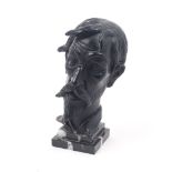 A black painted terracotta bust, possibly a representation of Miguel de Cervantes aging knight Don