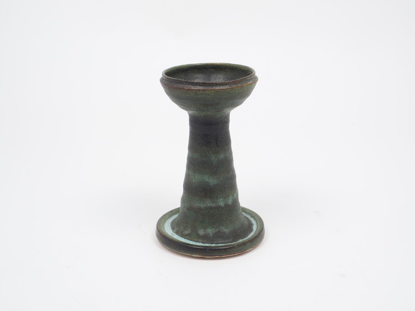 A collection of modern studio pottery style wares, to include: a stoneware candlestick, with