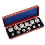 A cased set of twelve Art Nouveau silver buttons hallmarked London, c.1904, each with foreign import
