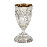 An ornately chased Victorian silver goblet, Sheffield, c.1886, William Padley & Son, the circular