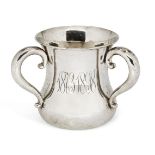 An American silver three-handled cup (tyg), of waisted form with scroll handles and monograms to