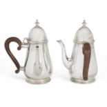 A pair of silver café-au-lait pots, London, c.1924, Reid & Sons Ltd, of baluster form with wooden