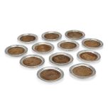 A set of twelve Continental silver coasters with turned wooden bases, all stamped sterling, each